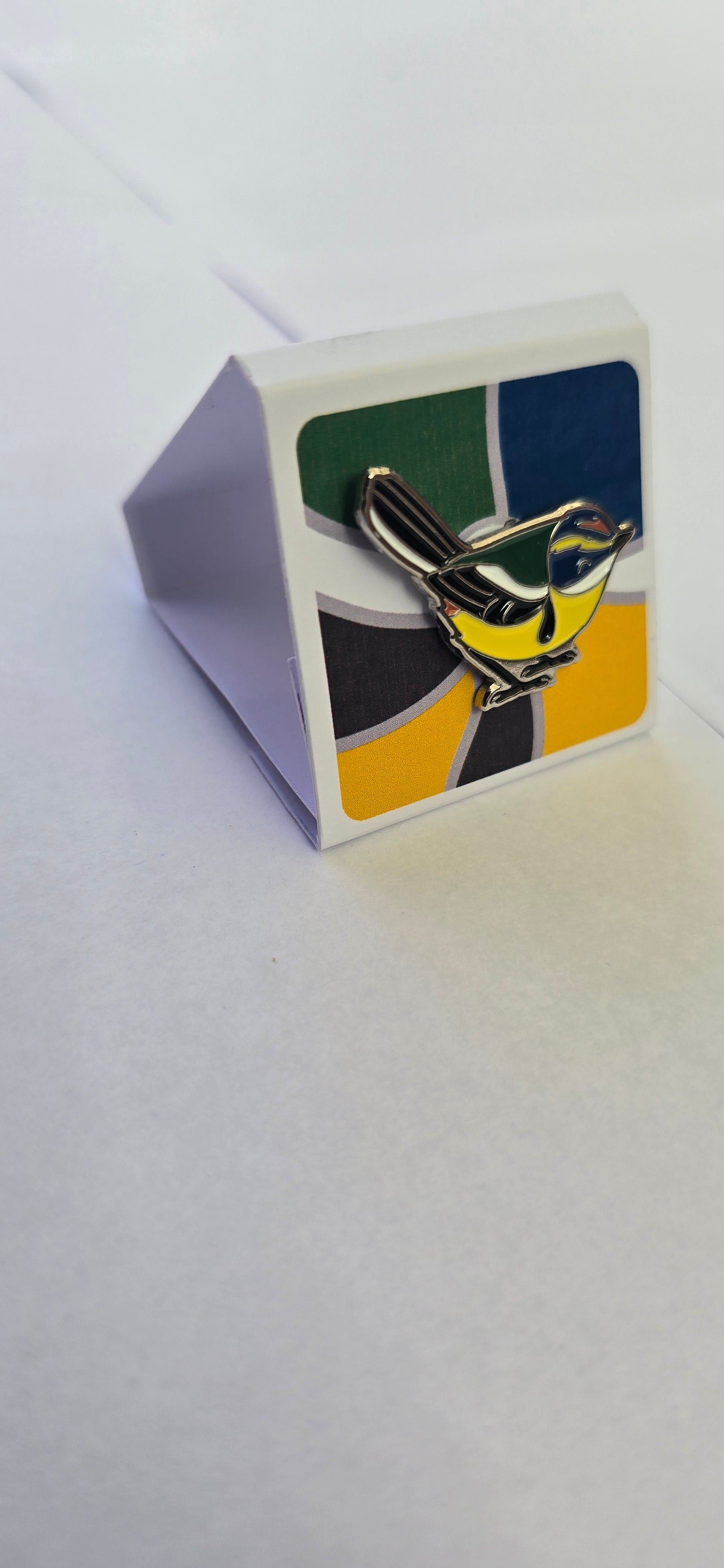 Pin sietecolores